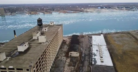 Sweeping shot around a decaying abandoned building on the Detroit River. Stock Footage 102579262