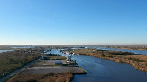 Sweeping shot overlooking far reaches of the bayou on a clear day Stock Footage 101304912