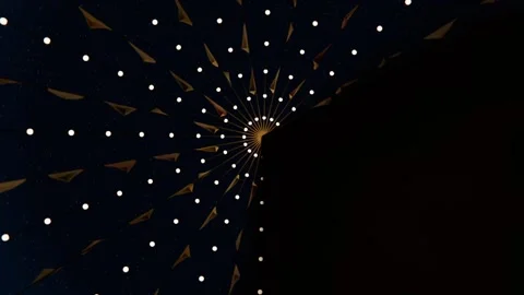 Sweeping tall dark shadow entering ceiling center, obscuring golden hub, white Stock Footage 339722070