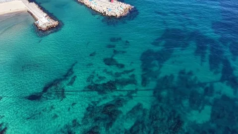 Sweeping Top Down Aerial View of Clear Turquoise Sea and Coastal Reef Stock Footage 344778297