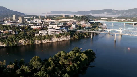 A sweeping view of Chattanooga captures the Ironman swim course winding below Stock Footage 320044129