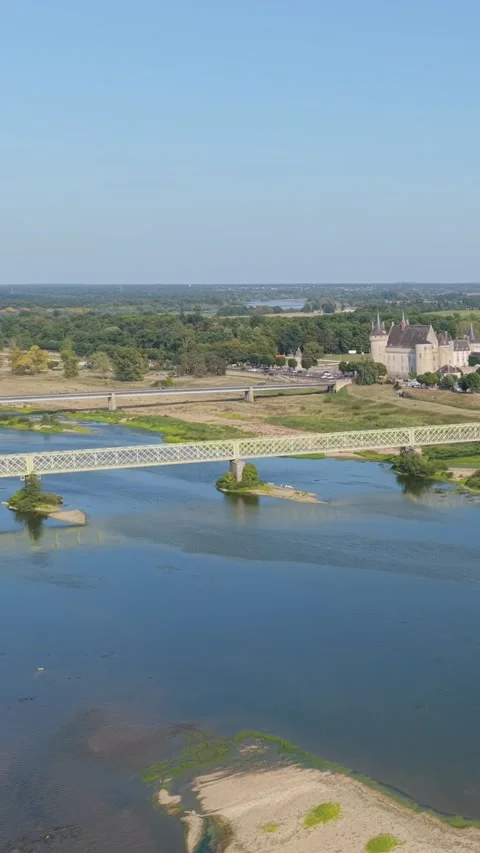 A sweeping view from the Loire River across a bridge, revealing the historic Stock Footage 346663471