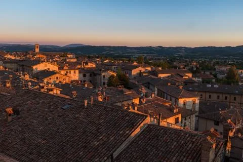 A sweeping view of the rooftops of Gubbio at sunset taken from the main Piazza Stock Photos