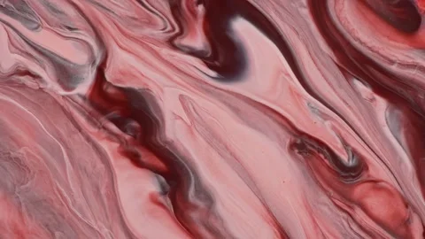 Sweeping waves of pink and brown merge in a marble fluid art pattern, creating Stock Footage 260978984