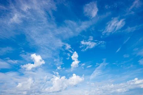 Sweeping Wispy Clouds Across Vivid Summer Sky Stock Photos