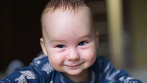Sweet adorable smile of a tiny infant kid. Cheerful kind face of a little baby Video stock 196697096