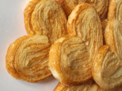 Sweet bakery piled on table Stock Photos