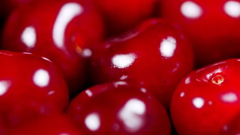 Sweet berries rotation. Ripe cherry berries on the counter of the vegetable Stock Footage 157933763