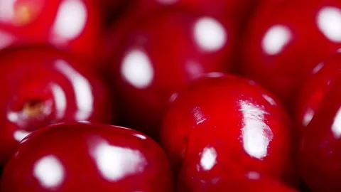 Sweet berries rotation. Ripe cherry berries on the counter of the vegetable Stock Footage 157946357