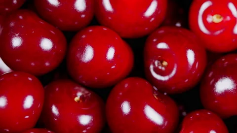 Sweet berries rotation. Ripe cherry berries on the counter of the vegetable Stock Footage 157948313