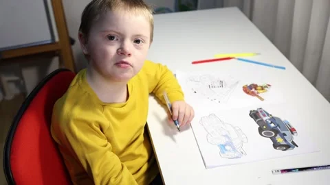Sweet boy sings a song while sitting on his desktop Stock Footage 300502683