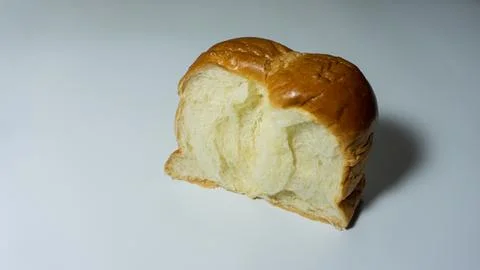 Sweet bread. Slice of sweet bread placed isolated on white background. Stock Photos