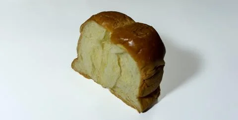 Sweet bread. Slice of sweet bread placed isolated on white background. Stock Photos