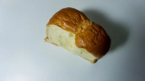 Sweet bread. Slice of sweet bread placed isolated on white background. Stock Photos