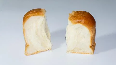 Sweet bread. Sweet bread that has been cut into two halves placed isolated .. Stock Photos