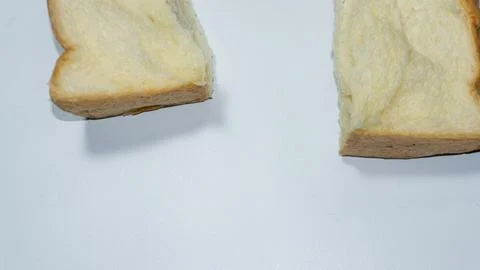 Sweet bread. Sweet bread that has been cut into two halves placed isolated .. Stock Photos