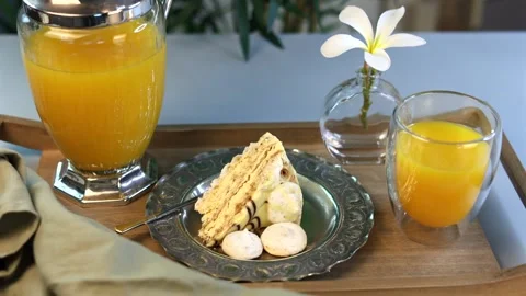 Sweet breakfast with golden cake slice, silver plate showing detailed patterns Video stock 295299858