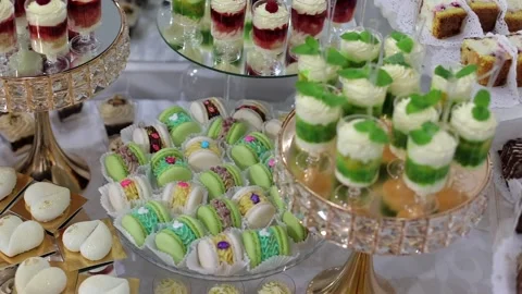 Sweet buffet, many different goodies. A sweet table at a wedding Stock Footage 288482604