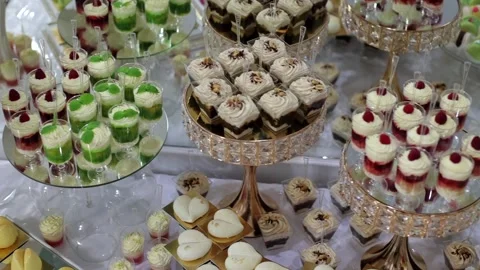 Sweet buffet, many different goodies. A sweet table at a wedding Stock Footage 288482627