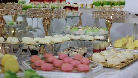 Sweet buffet, many different goodies. A sweet table at a wedding Stock Footage 288482631