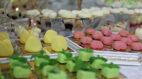 Sweet buffet, many different goodies. A sweet table at a wedding Stock Footage 288482640