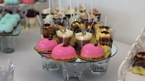 Sweet buffet, many different goodies. A sweet table at a wedding Stock Footage 288482681