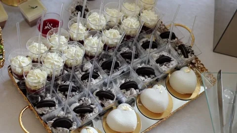 Sweet buffet, many different goodies. A sweet table at a wedding Stock Footage 288482691