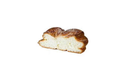 Sweet bun in section on a white background. Plushka bun from Berdyansk bakery Stock Photos