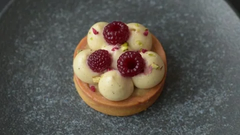 Sweet cake or tart round with cream and raspberries. Raspberry sweet tart Stock Footage 314979439