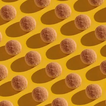 Sweet candies pattern on a yellow Stock Photos