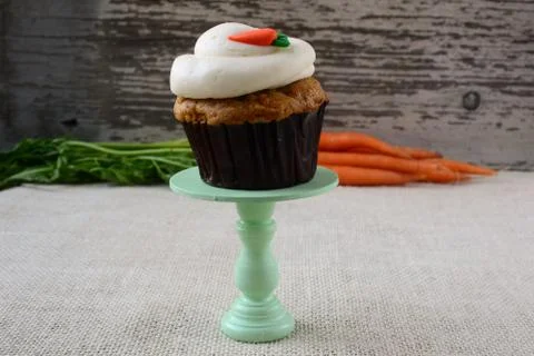 Sweet carrot cupcake with rustic background Stock Photos
