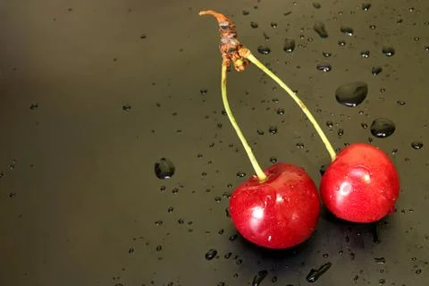 Sweet cherry on black background Stock Photos