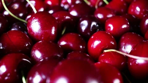 Sweet cherry cherries texture closeup on rotating plate Stock Footage 98494250