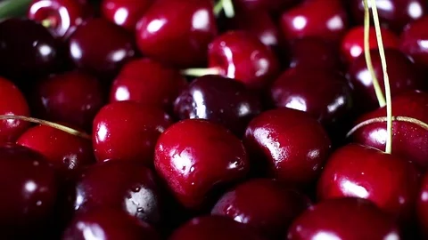 Sweet cherry cherries texture closeup on rotating plate Stock Footage 98494564