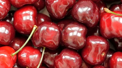 Sweet cherrys spin in a circle, top view. Stock Footage 125807490