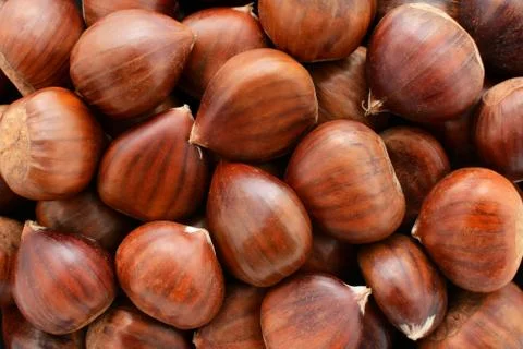 Sweet chestnuts background Stock Photos
