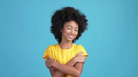 Sweet child cuddle hands shoulders esteem isolated blue color background Stock Footage 169237528