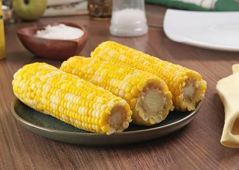 Sweet cooked corn fruit on plate. Food and cooking. Health and nutrition Stock Photos