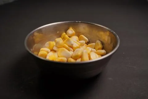 Sweet Corn : Corn kernels are small maize fruits containing a hard shell Stock Photos