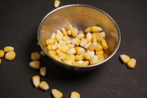 Sweet Corn : Corn kernels are small maize fruits containing a hard shell Stock Photos