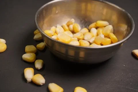 Sweet Corn : Corn kernels are small maize fruits containing a hard shell Stock Photos