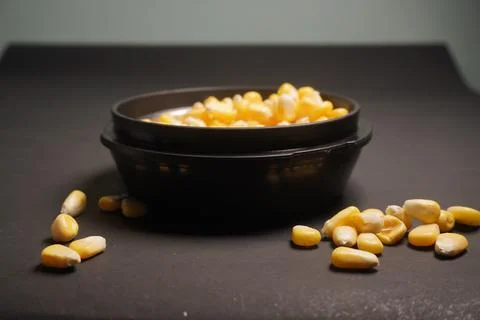 Sweet Corn : Corn kernels are small maize fruits containing a hard shell Stock Photos