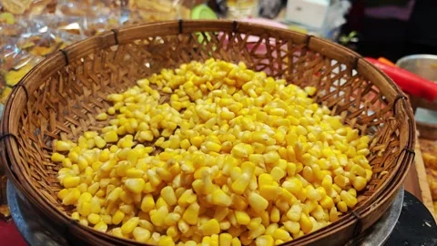 Sweet corn kernels background in woven basket Stock Footage 341337163