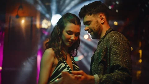 Sweet couple dancing together at disco lights closeup. Romantic pair moving Vídeo Stock 334115599