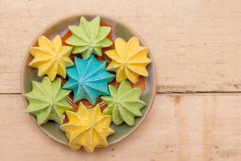 Sweet, crispy, multi-colored meringue in a plate. Stock Photos
