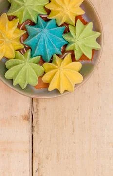 Sweet, crispy, multi-colored meringue in a plate. Stock Photos