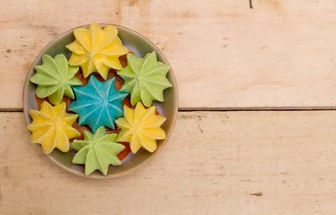 Sweet, crispy, multi-colored meringue in a plate. Stock Photos