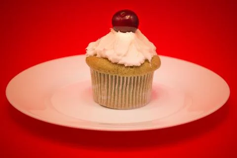 Sweet cupcake with cherry Stock Photos