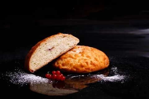 Sweet cupcake in round bread shape with filling. Photo in section. Stock Photos