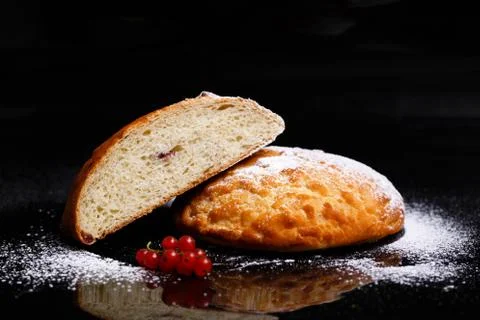 Sweet cupcake in round bread shape with filling. Photo in section. Stock Photos